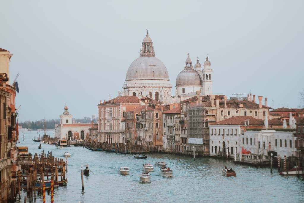 Beautiful Venice Grand Canal view with Basilica di Santa Maria della Salute in daylight, perfect for travel and architecture theme.