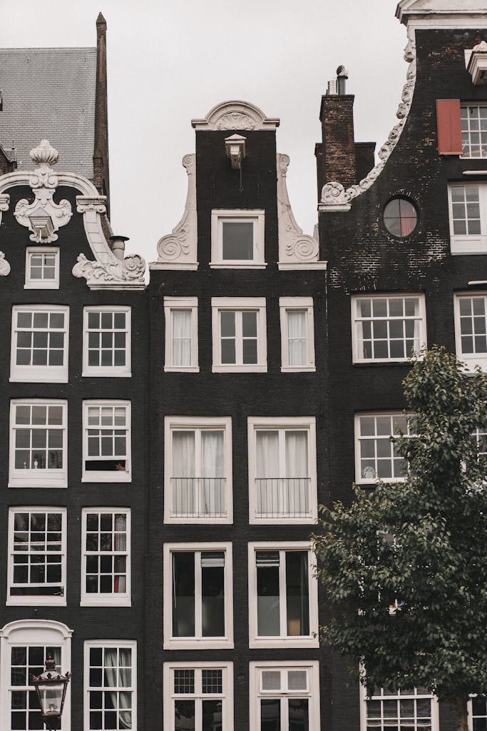 Elegant Dutch architecture featuring classic canal houses in Amsterdam.